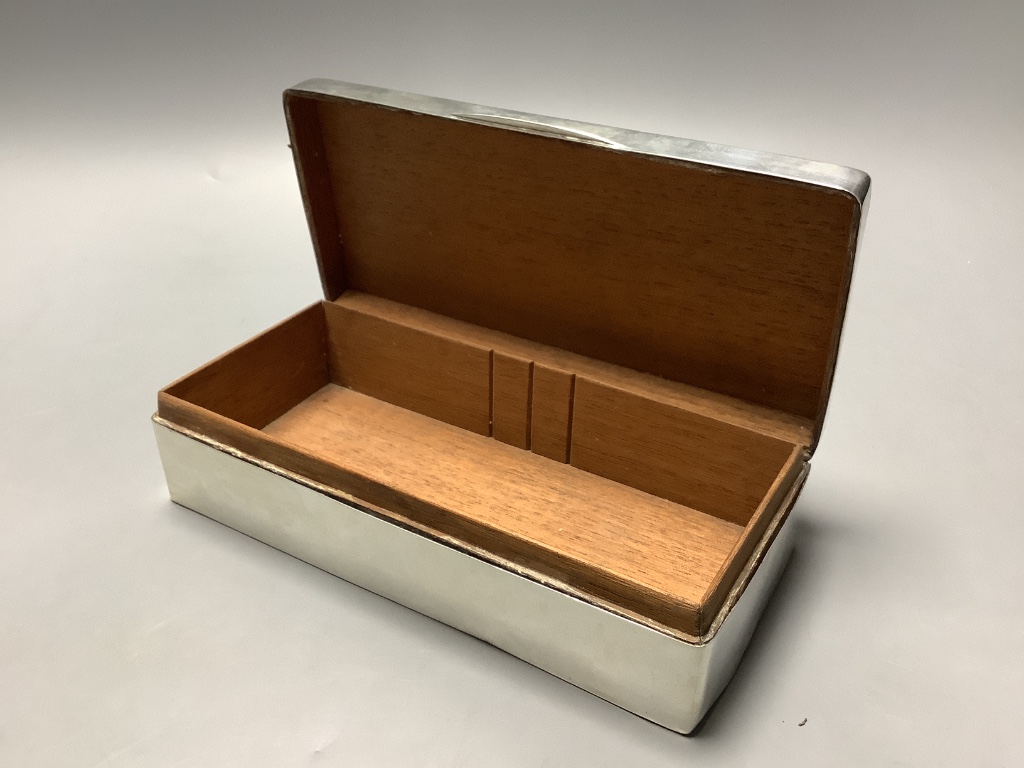 A George V silver mounted rectangular cigarette box, Birmingham, 1929, 19.3 cm.